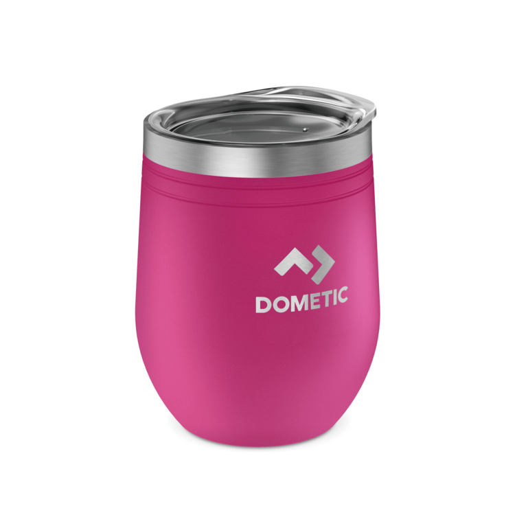 Pink insulated Dometic tumbler with silver lid on a white background.