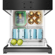 Top view of an open Dometic NRXD refrigerator with food items including bottles, cans, and fruits on a white background