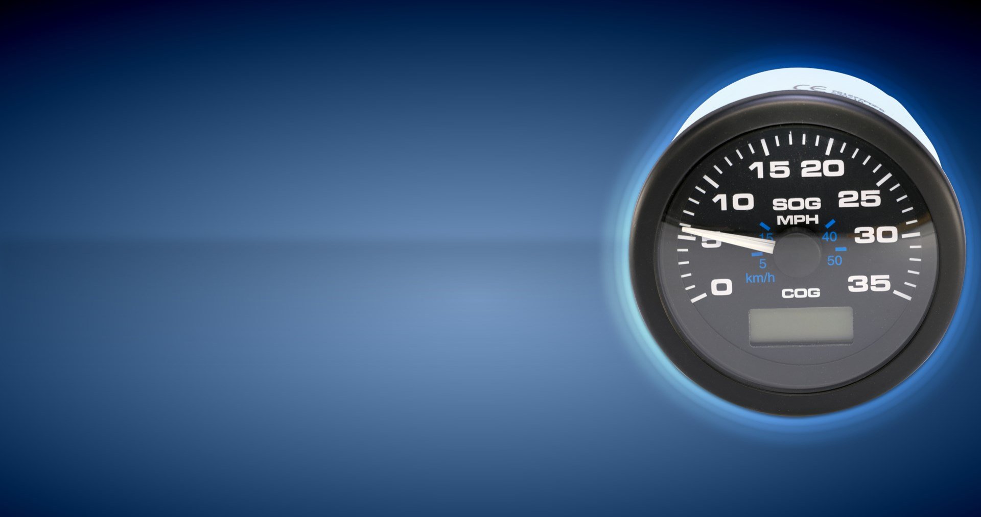A black Sierra branded speedometer boat gauge against a black and blue background