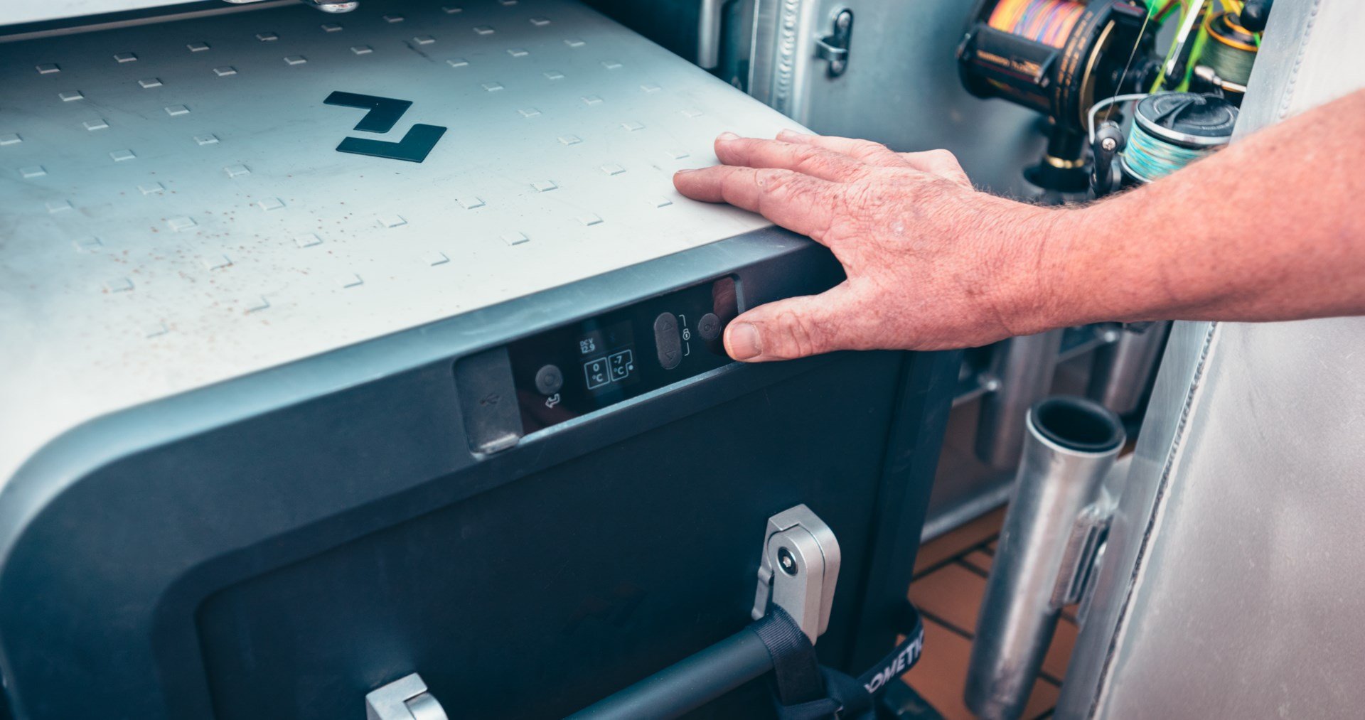A Dometic CFX3 powered cooler in a boat deck compartment