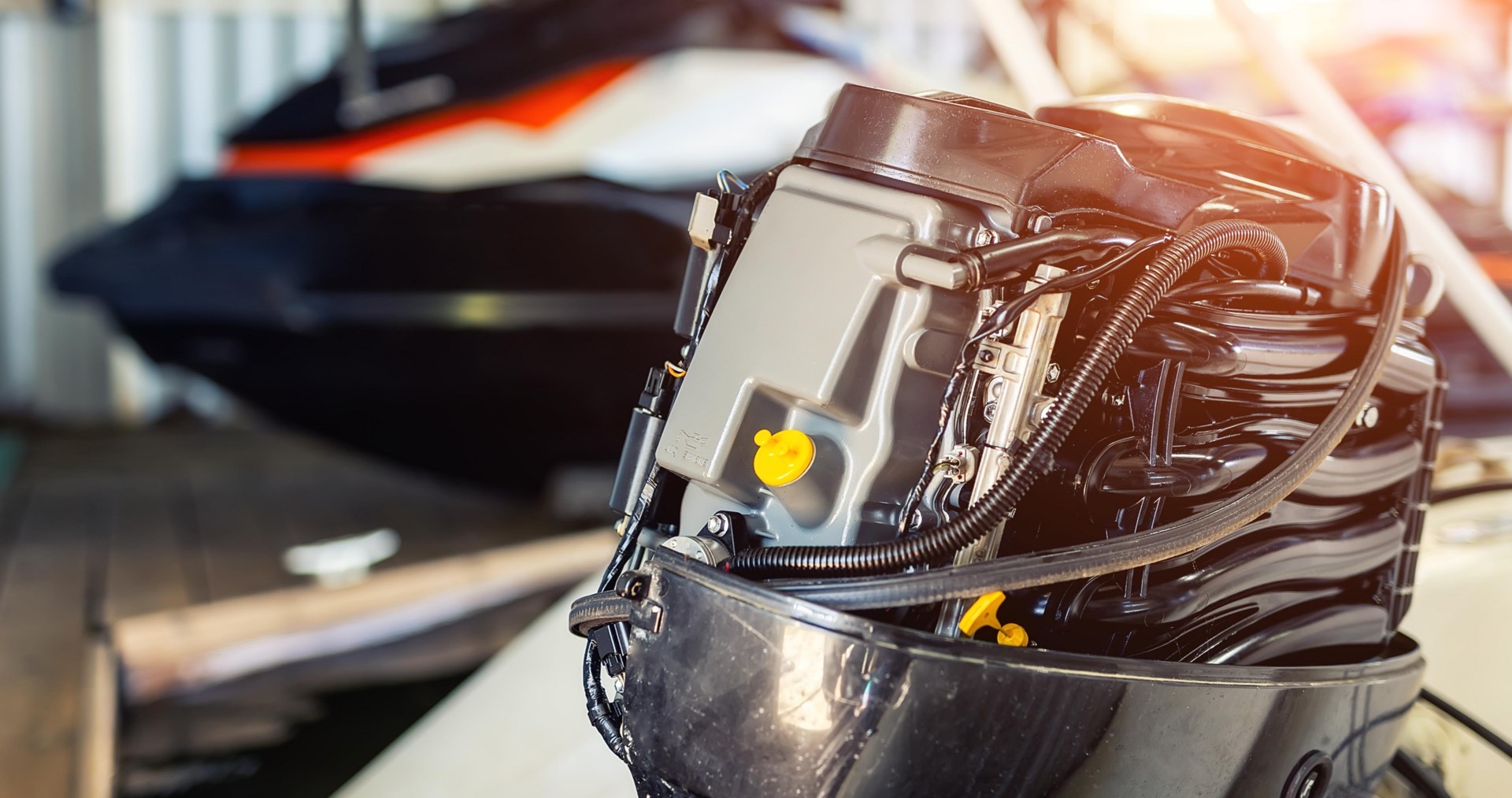 An exposed outboard boat motor in a workshop